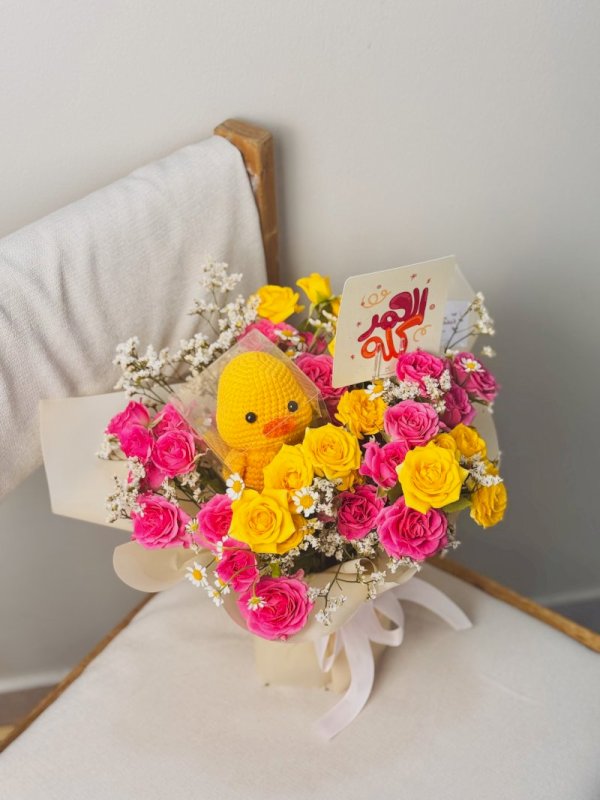 باقة ورد مع بطه بالكورشي