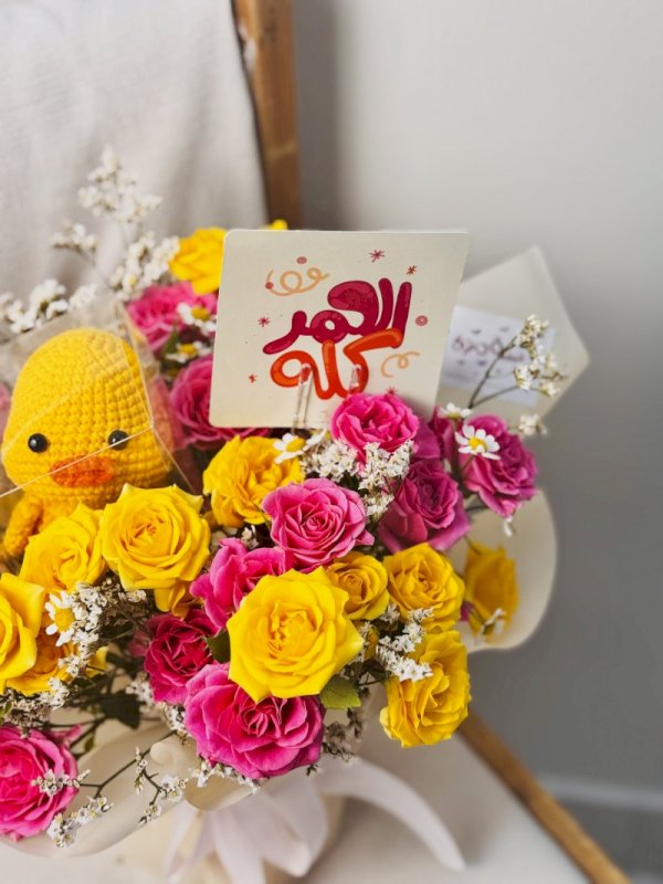 باقة ورد مع بطه بالكورشي