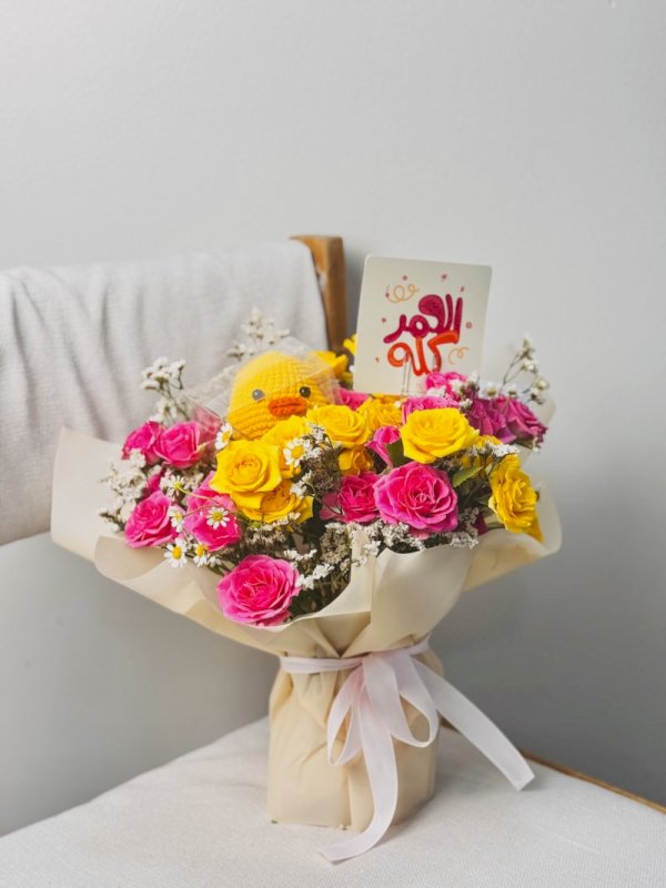 باقة ورد مع بطه بالكورشي